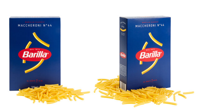 Munich, 05.22.2023: box of Italian Barilla brand short "Maccheroni" / macaroni pasta surrounded by the respective noodles isolated over transparency, two perspectives, cut-out food design element