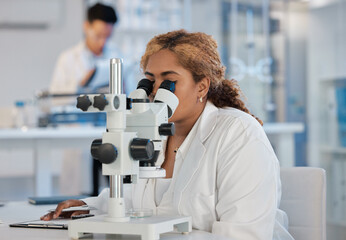 Science, research and microscope with a woman at work in a laboratory for innovation or investigation. Healthcare, medical and experiment with a female scientist working in a lab for pharmaceuticals