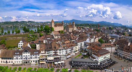 Fototapeta premium Rapperswil - Jona - scenic medieval town and castle in lake Zurich, aerial drone view. Switzerland travel and landmarks.