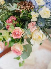 Delicate bouquet of blue hydrangea, pink and white peonies and roses, carnations. Flowers close-up, flower decor.