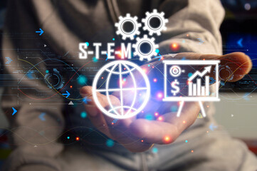 Obraz na płótnie Canvas STEM Smart Industrial Technological Innovation concept. Science Technology Engineering Math Industry 5.0. Engineer using virtual touchscreen touched stem icon..