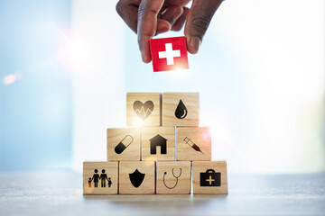 Hand, building blocks and man with cross, medical or icons for investment, security and insurance. Finger, choice and male with puzzle for healthcare, family or asset management, safety or planning