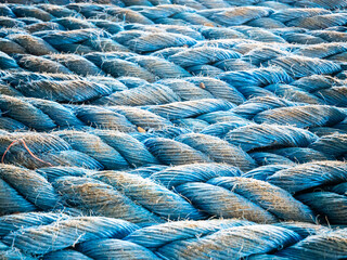 Nylon blue towing rope prepared and laying ready for towing operations on aft station of cargo...