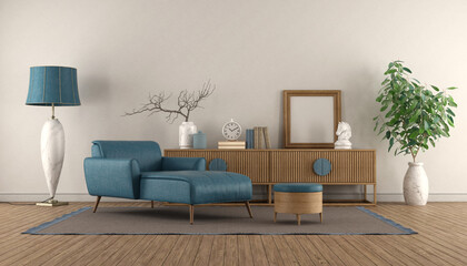 Blue chaise lounge and vintage sideboard in a white living room