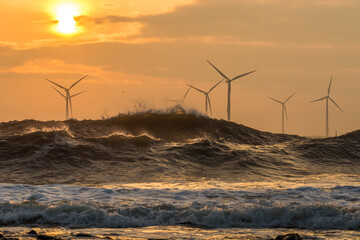 Wind turbines battered by waves