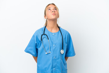 Little caucasian girl disguised as surgeon isolated on white background and looking up