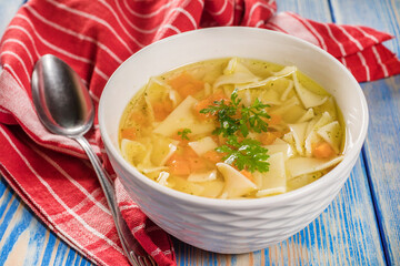 Broth - chicken soup in a bowl.