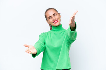 Young caucasian woman isolated on white background presenting and inviting to come with hand