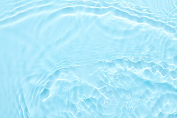 Water blue surface abstract background. Waves and ripples of cosmetic moisturizer with bubbles