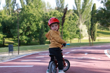 BOY ON BIKE IN THE PARK