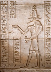 ancient Egyptian bas relief on the wall depicting Thoth