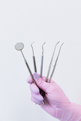 dentist doctor's tool in woman's hand