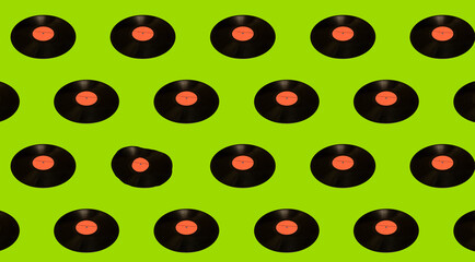 Collage of vinyl records on a light green background