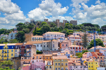View of colorful residential buildings and the ancient castle of Castelo de S.Jorge in Lisbon, Portugal