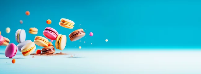 Rolgordijnen Holiday sweet food banner with flying cake macaron or macaroon on blue background. Testy, healthy dessert. Colorful almond french cookies. Front view, copy space. Generative ai © KRISTINA KUPTSEVICH