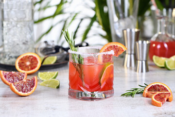 Red Sicilian Orange Paloma Cocktail of tequila, fresh lime and rosemary with red Sicilian orange...