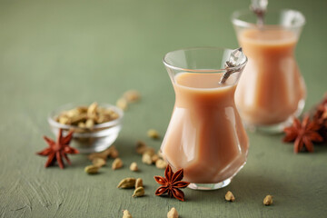 Obraz na płótnie Canvas Traditional middle eastern beverage, indian drink masala or arabian karak chai. Closeup