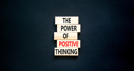Positive thinking symbol. Concept words The power of positive thinking on wooden block. Beautiful black table black background. Business, motivational positive thinking concept. Copy space.