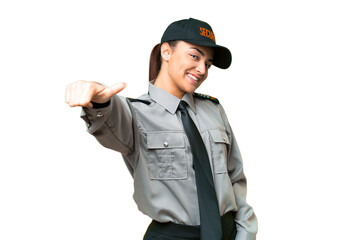 Young safeguard woman over isolated chroma key background giving a thumbs up gesture