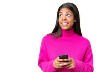 Young African American woman over isolated background using mobile phone and looking up