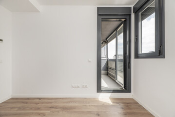 An empty bedroom with a window