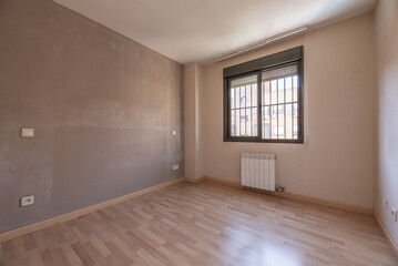 An empty room with dirty brown walls