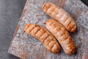 Delicious grilled sausages from chicken or pork meat with salt, spices and herbs