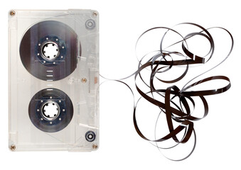 Unrolled cassette tape with recorded music. Isolated background.