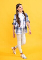 full length of teen girl isolated on yellow. teen girl in studio. teen girl on background.