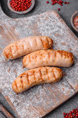 Delicious grilled sausages from chicken or pork meat with salt, spices and herbs