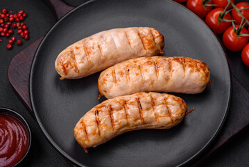 Delicious grilled sausages from chicken or pork meat with salt, spices and herbs