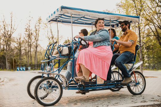 4 friends ride a bike