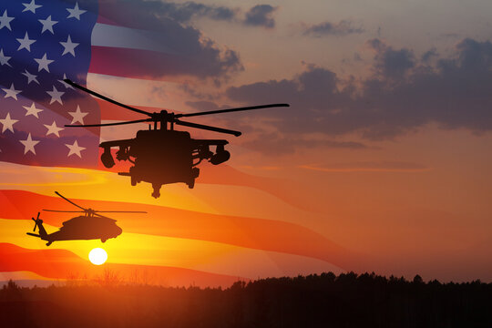 Silhouettes of helicopters on background of sunset with a transparent American flag.