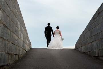 bride and groom walking in fortress