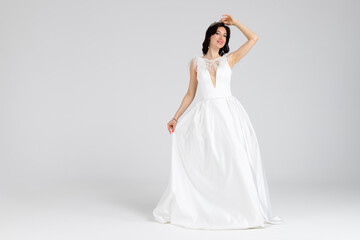 Beautiful bride in elegant white dress. isolated on white background. full length