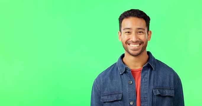 Portrait, yes and happy man on green screen with mockup, agreement and space for product or information. Happiness, positive opinion and model with smile, nodding head and good review announcement.