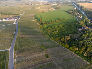 Panoramic aerial view on green premier cru champagne vineyards and fields near village Hautvillers...