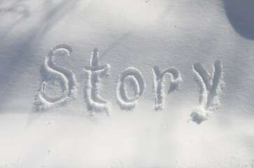 The inscription STORY on the snow