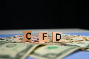 inscription cfd next to american dollars. CFD is Contract for Difference. Investing in contracts