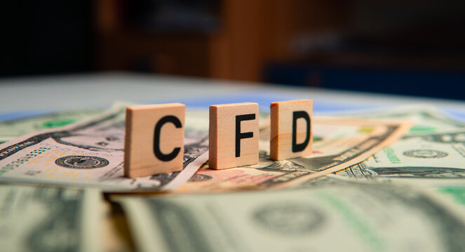 inscription cfd next to american dollars. CFD is Contract for Difference. Investing in contracts
