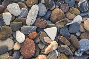 Abstract nature pebbles background. Blue stone pebbles texture. Stone background. Blue vintage color. Sea pebble beach. Beautiful nature background. Turquoise color. Sea pebbles wallpaper in colorful.