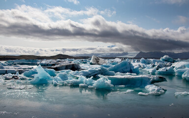 Glacier lagoon in Iceland with blue sky and ice floes in the water