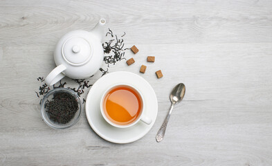 Obraz na płótnie Canvas Cup of Tea on a light wooden background