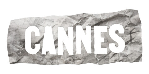 Cannes city name cut out of crumpled newspaper in retro stencil style isolated on transparent background