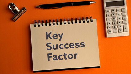 There is notebook with the word Key Success Factor. It is an abbreviation for Key Success Factor as eye-catching image.