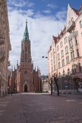 Fototapeta na wymiar Church of St. Gertrude on the streets of Riga, Latvia on a sunny day