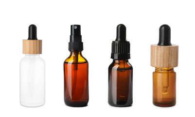 Set of different cosmetic oils in bottles on white background