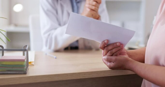 Woman, doctor and hands with sick note for patient diagnosis, illness or prescription on desk at clinic. Hand of female medical expert giving doctors certificate for healthcare visit or consultation