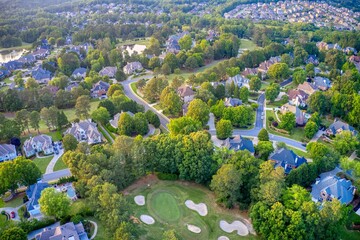 Aerial panoramic view of an upscale subdivision shot during golden hour.