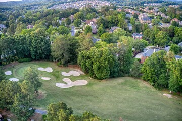 Obraz premium Aerial panoramic view of an upscale subdivision shot during golden hour